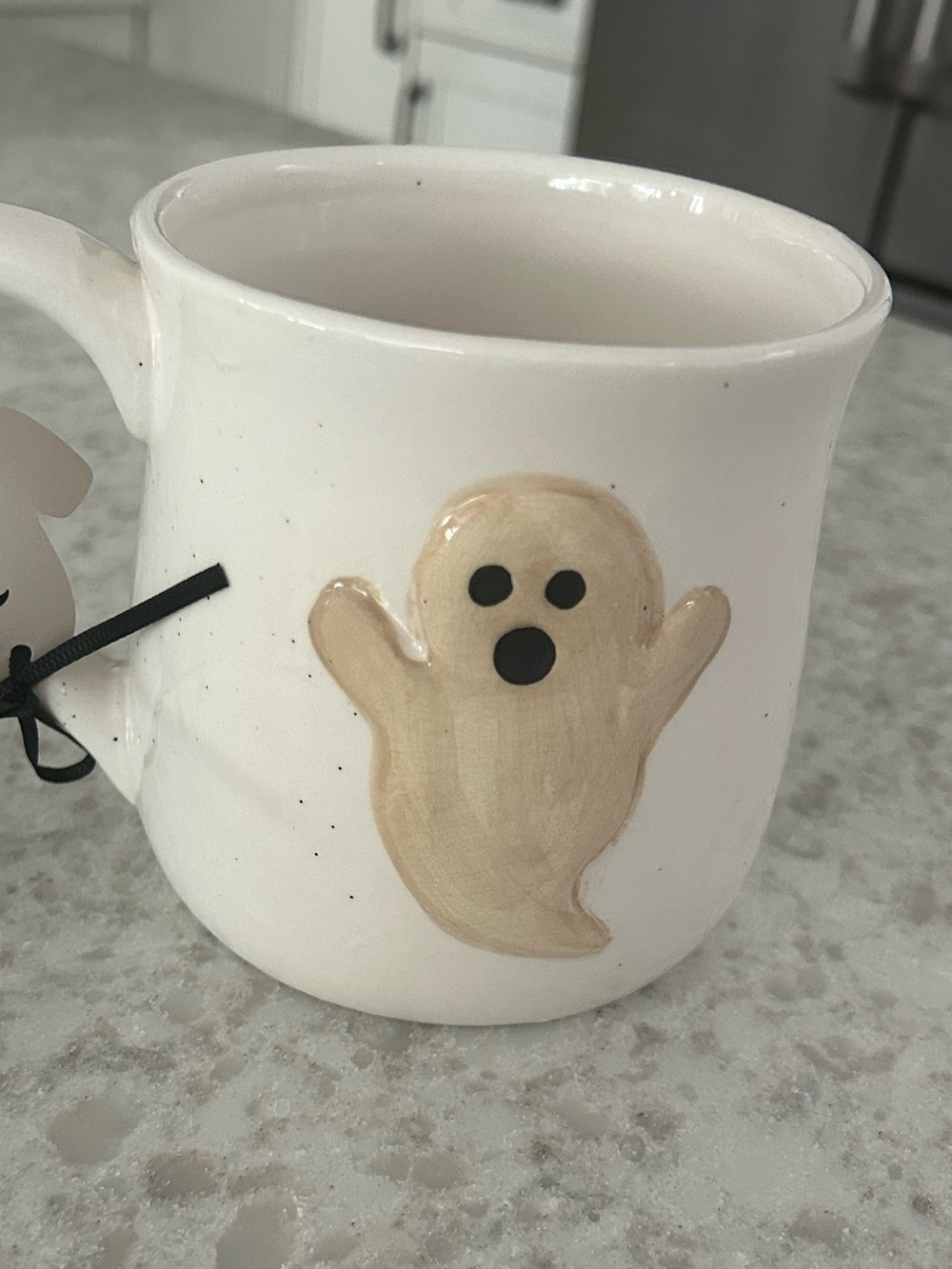 “New” Goblin & Ghoul Speckled White Ceramic Mug with Beige Ghost Accent